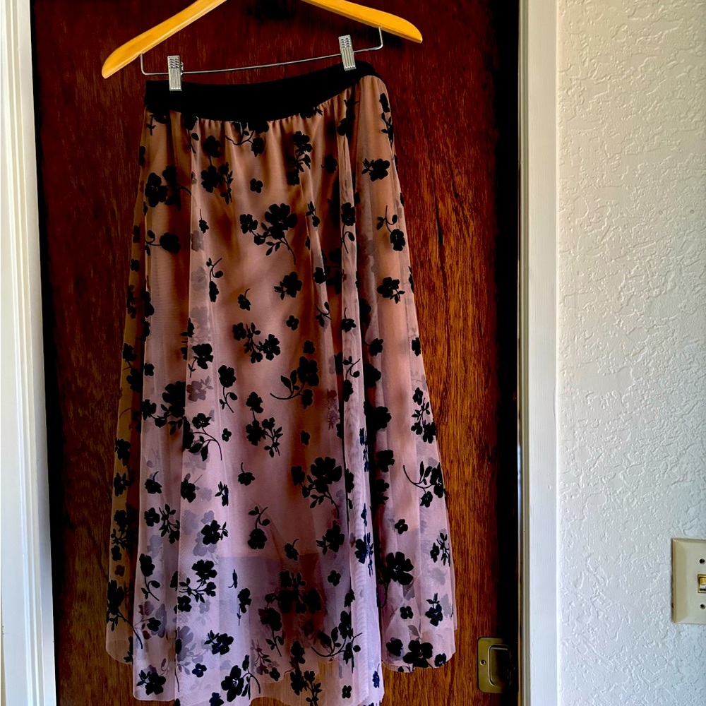 Pretty skirt with flocked black flowers on brown netting type fabric